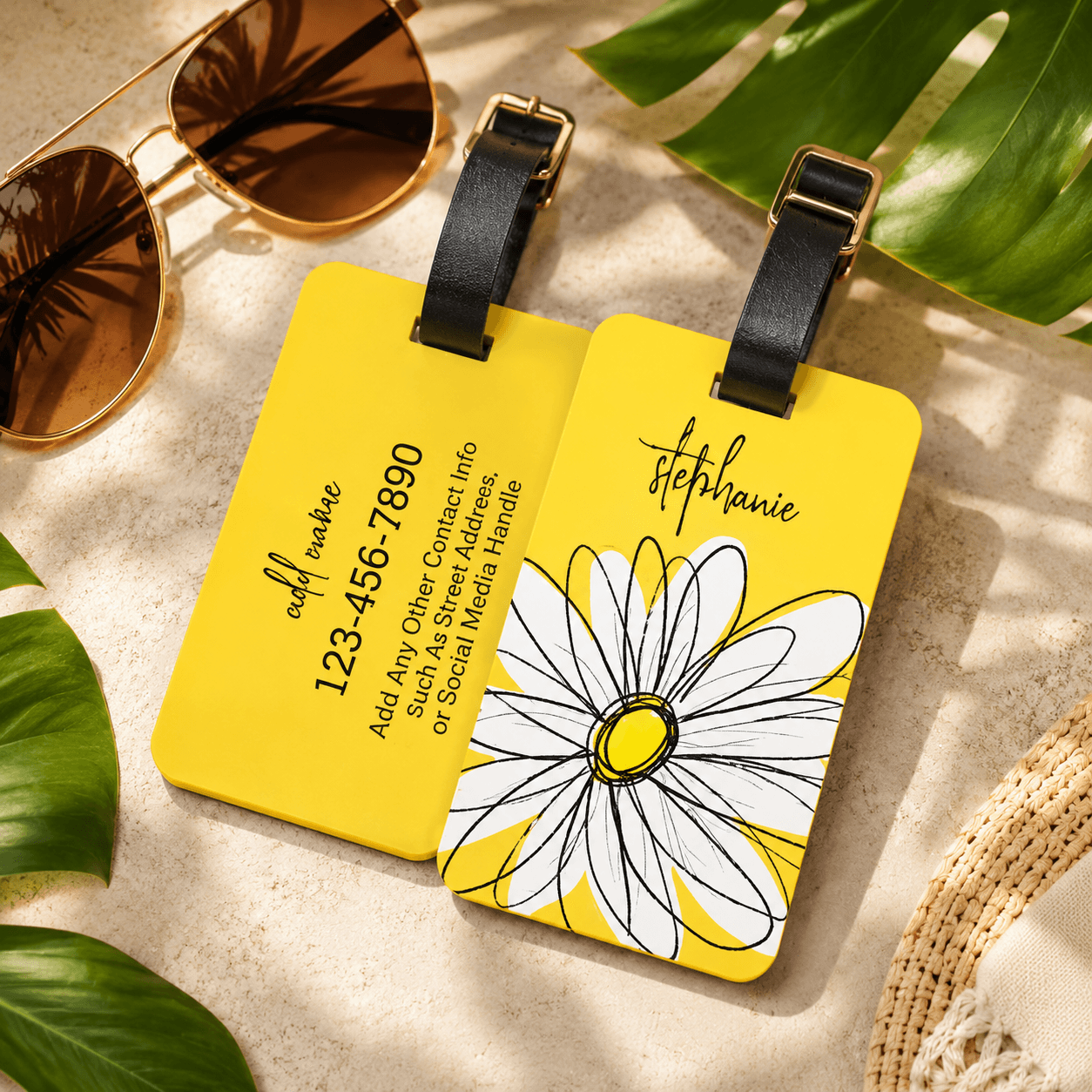 Pair of yellow luggage tags with a daisy design and a handwritten name