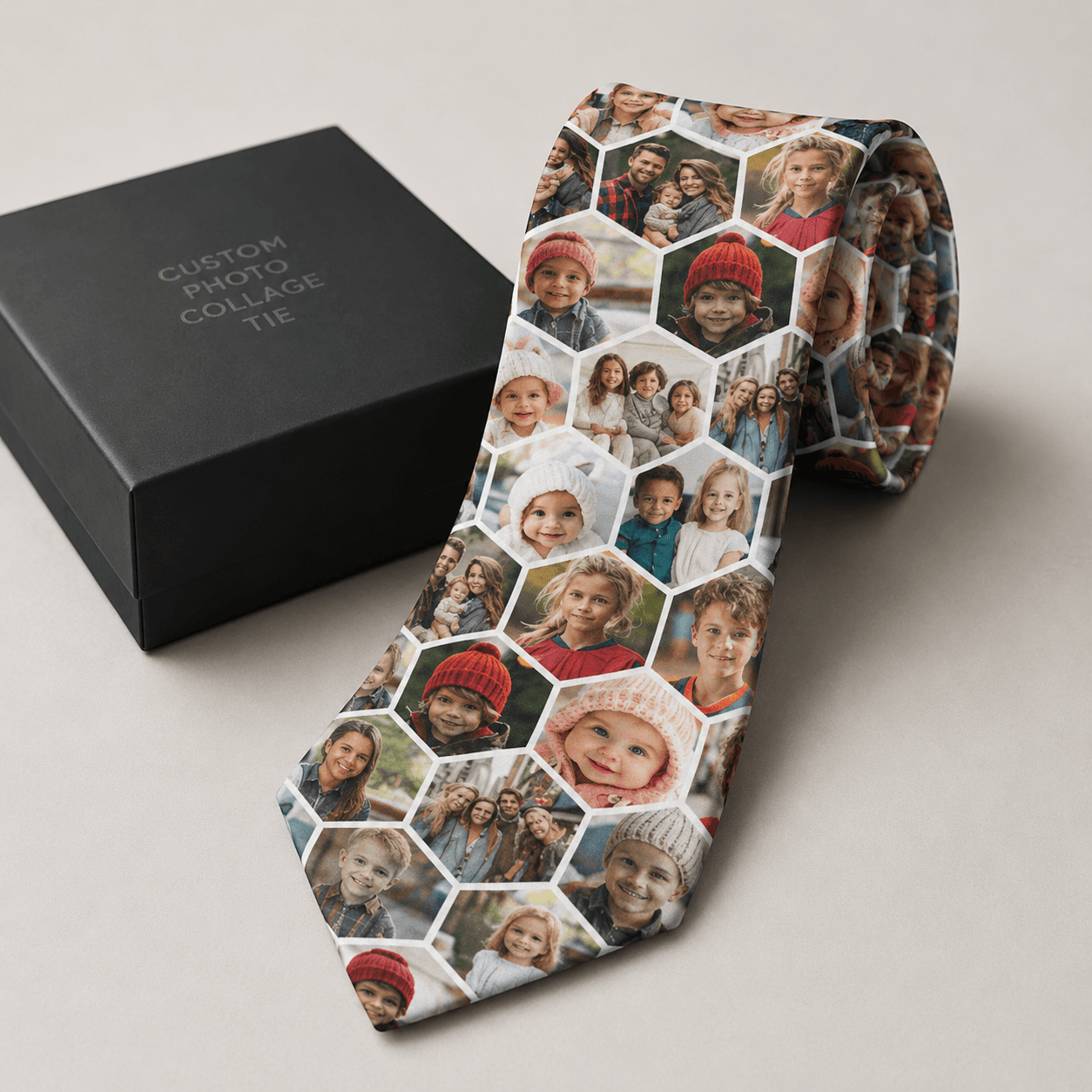 Photo collage necktie beside a black gift box